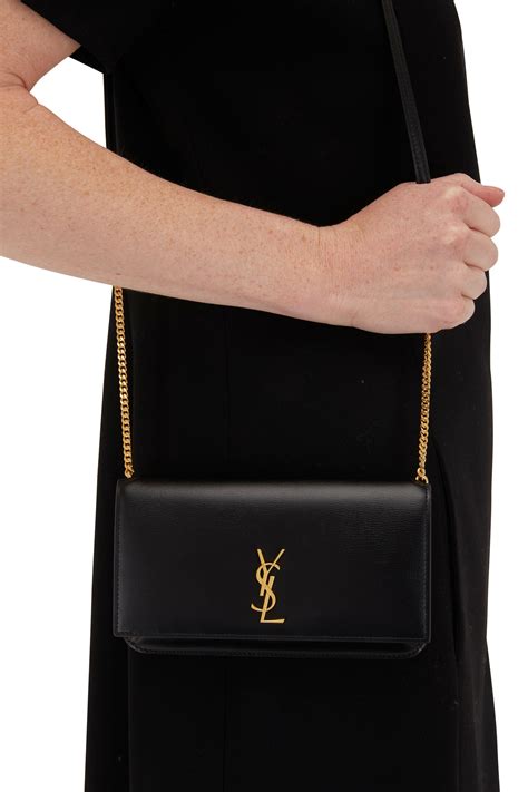 pochette telephone yves saint laurent|CASSANDRE phone holder in smooth leather .